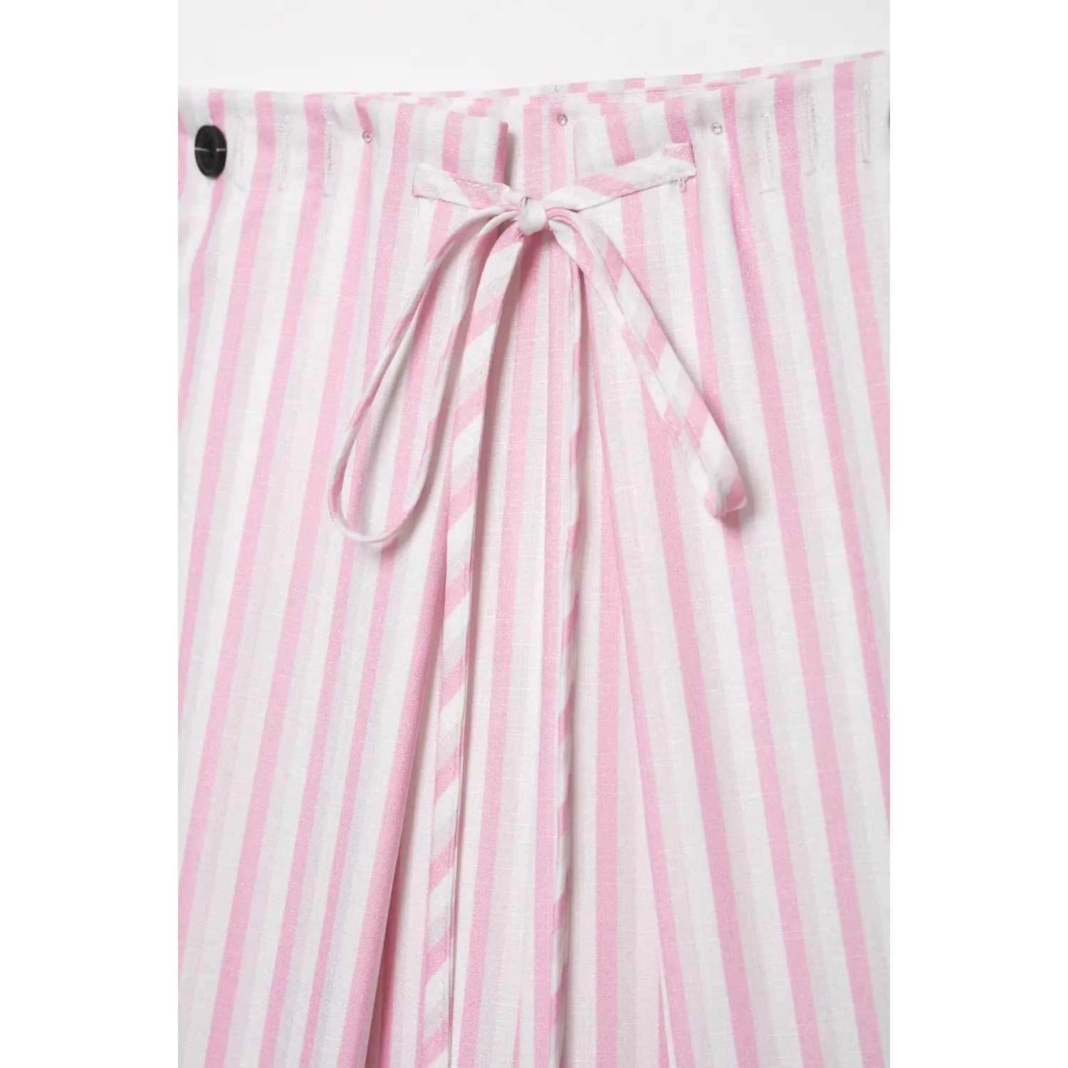 Front waist detail of pink white vertical stripe wide leg pants, self tie bow knot and black button closure
