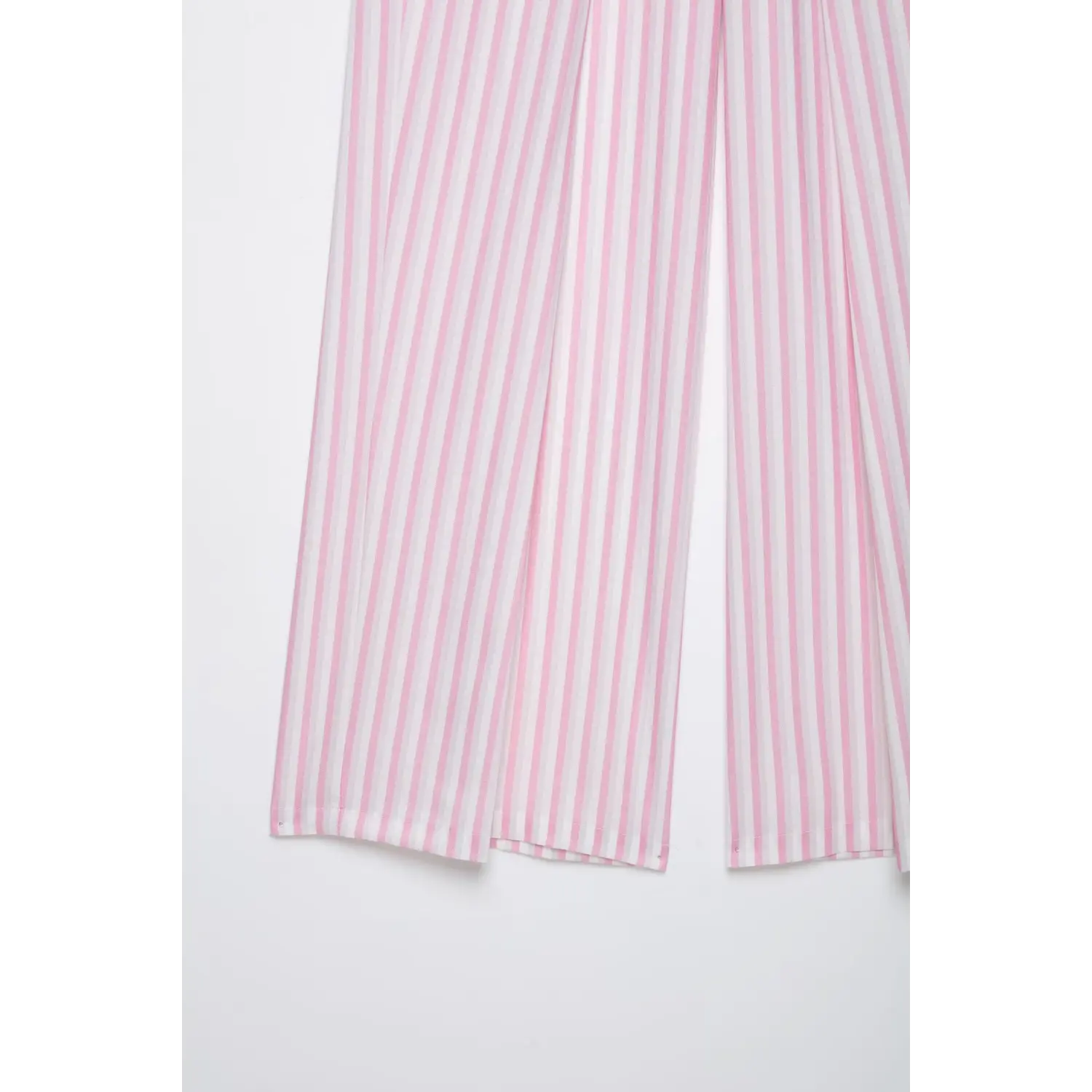 Hem and cuff detail of pink white vertical stripe wide leg pants, finished stitching, white background