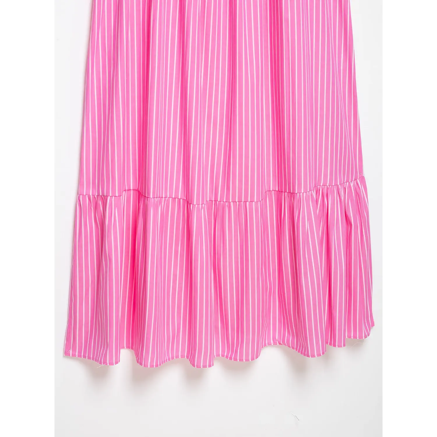 Bottom hem full ruffle tier closeup, clean overlock hem edge, evenly spaced vertical pink white stripe weave