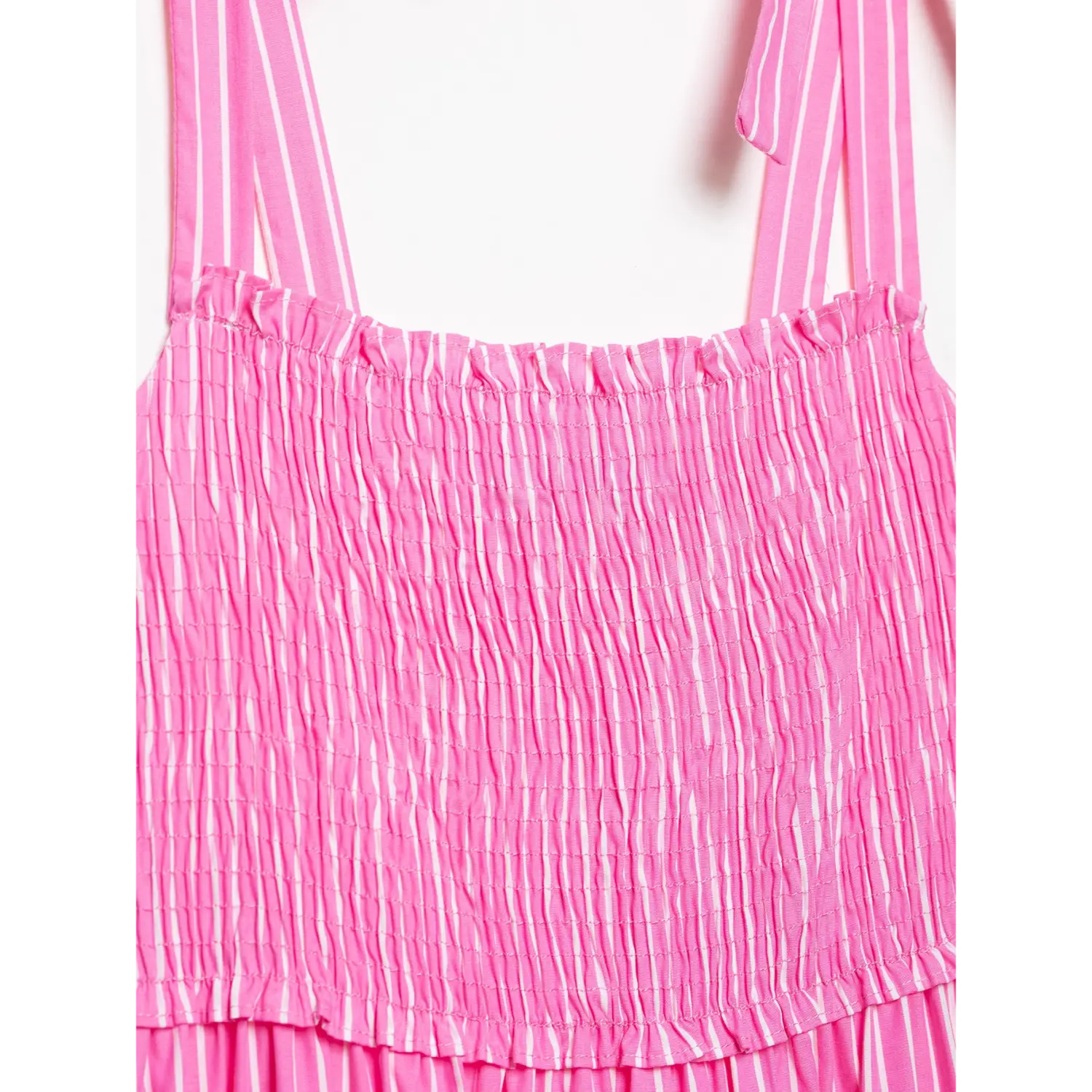 Extreme closeup shoulder self-fabric tie bow, wide matching striped strap, neat folded binding seam, soft lightweight woven material