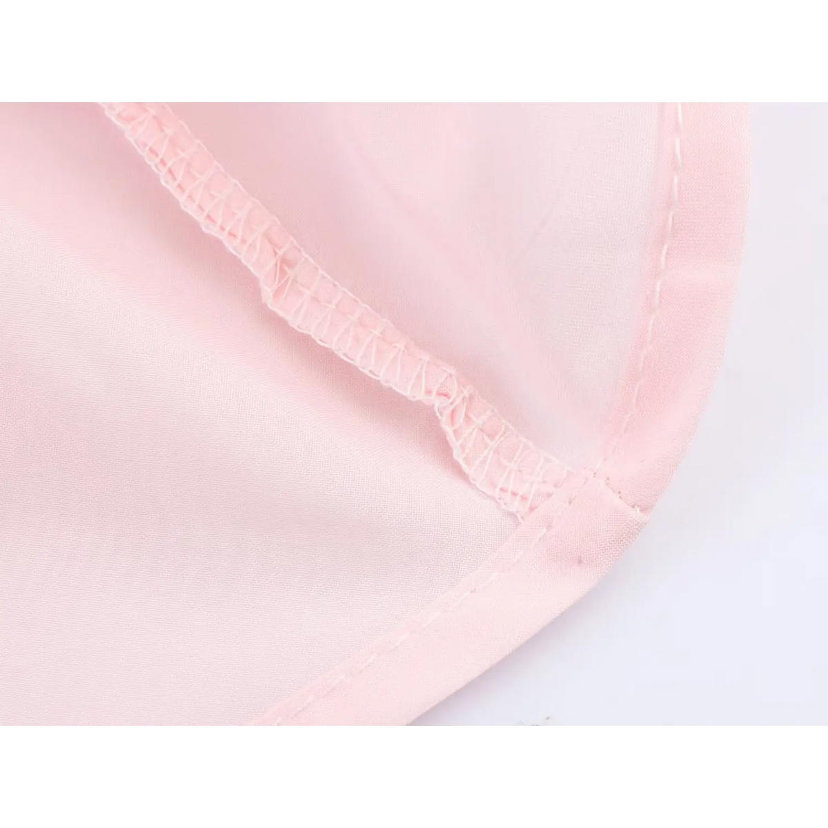 Close‑up of dress hem stitching detail