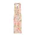 Front full view of pink floral print halter neck maxi dress with back tie detail