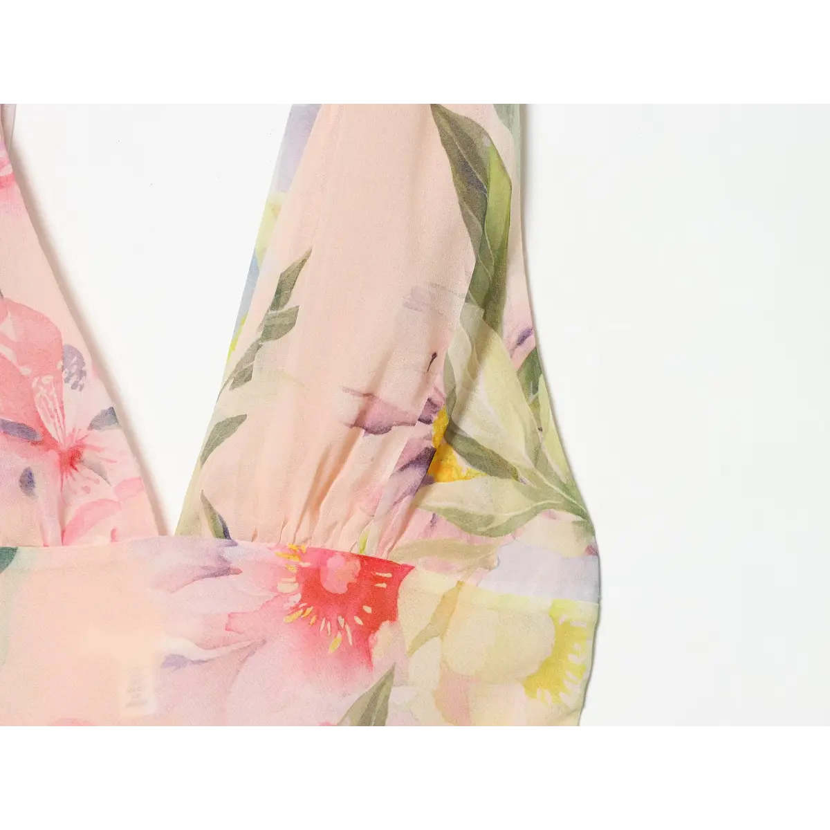 Close‑up of halter neck tie‑back detail at dress back bodice