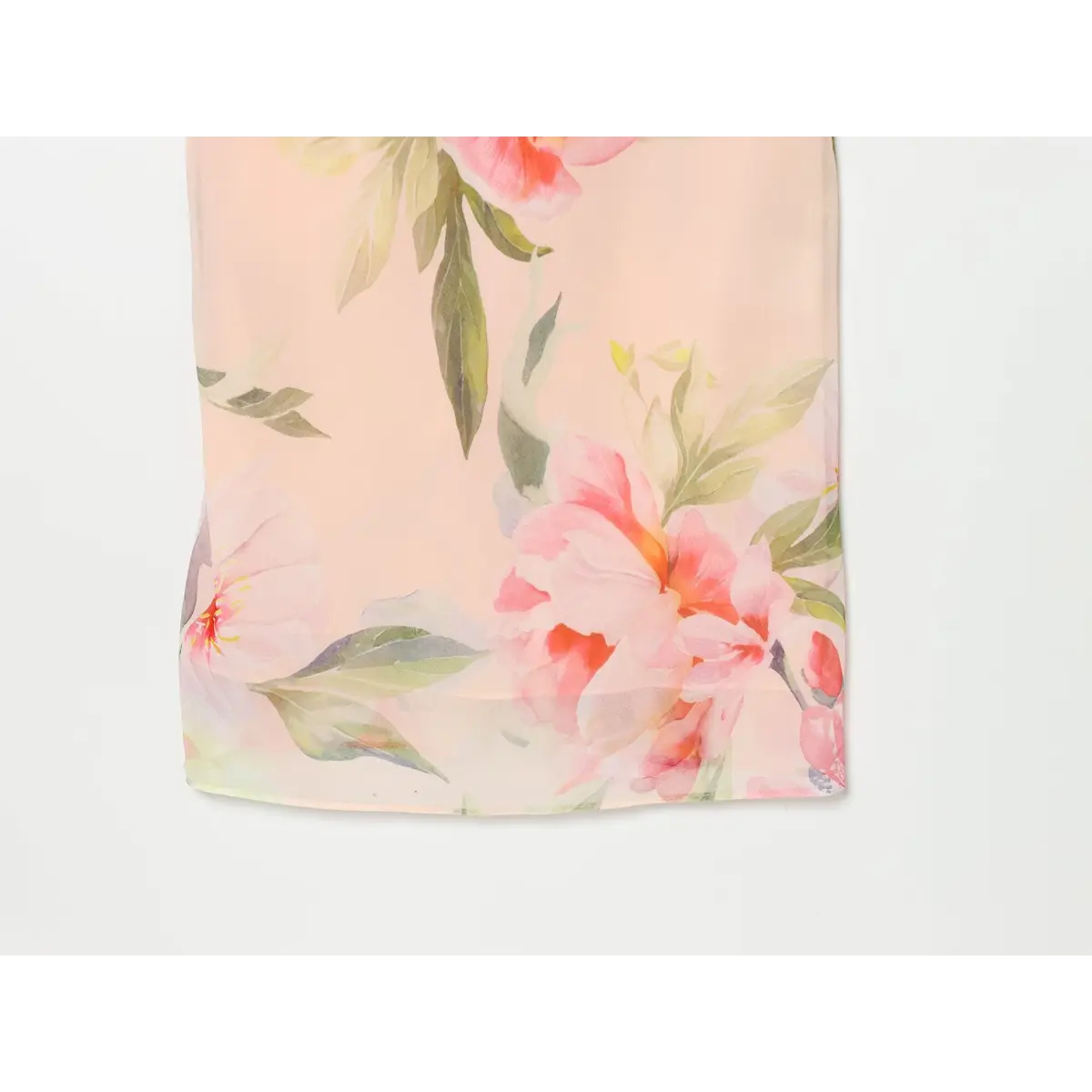 Detail view of floral print on lower skirt section of halter maxi dress