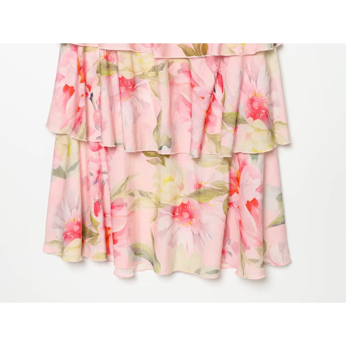 View of bottom cascading ruffle tiers of pink floral maxi dress