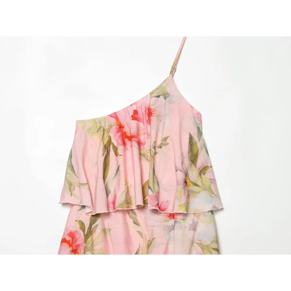 Detail shot of cascading tiered ruffle layers on floral maxi dress