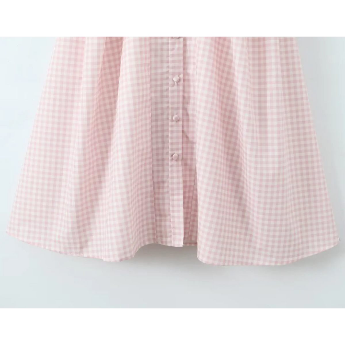 View of flowy a‑line skirt and front button detail
