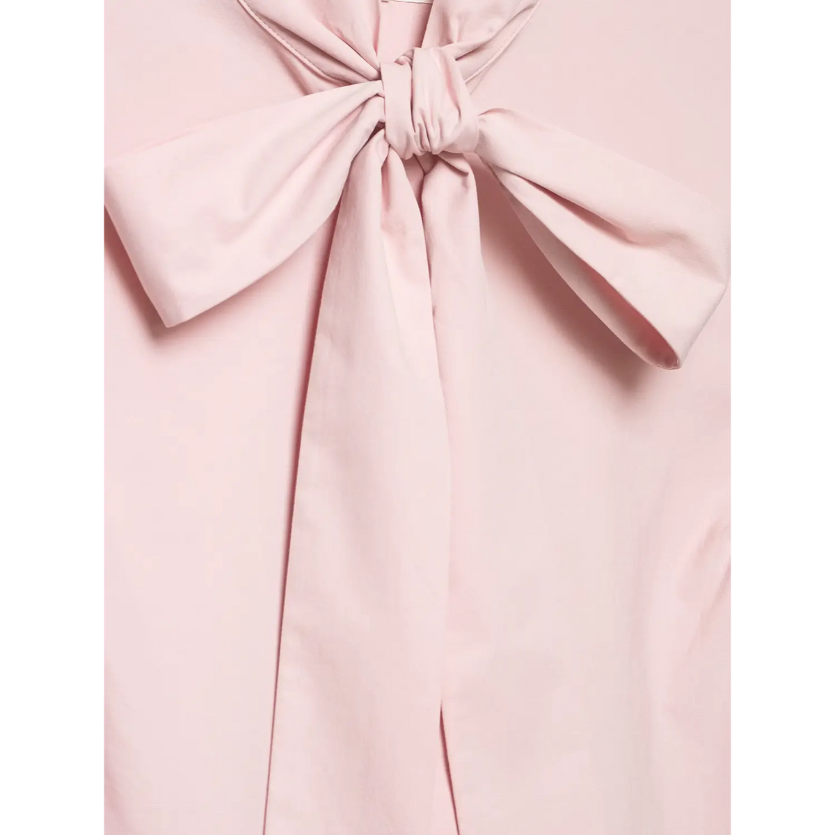 Macro close‑up of front neck bow knot stitching