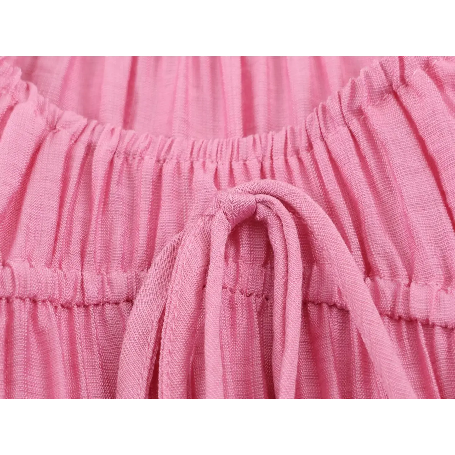 Macro close‑up of front tie knot on smocked bodice