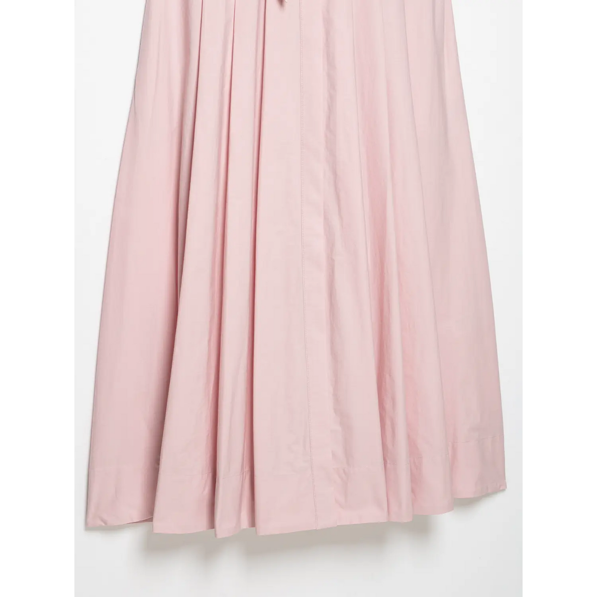 Partial flat view of pleated flowy skirt fabric