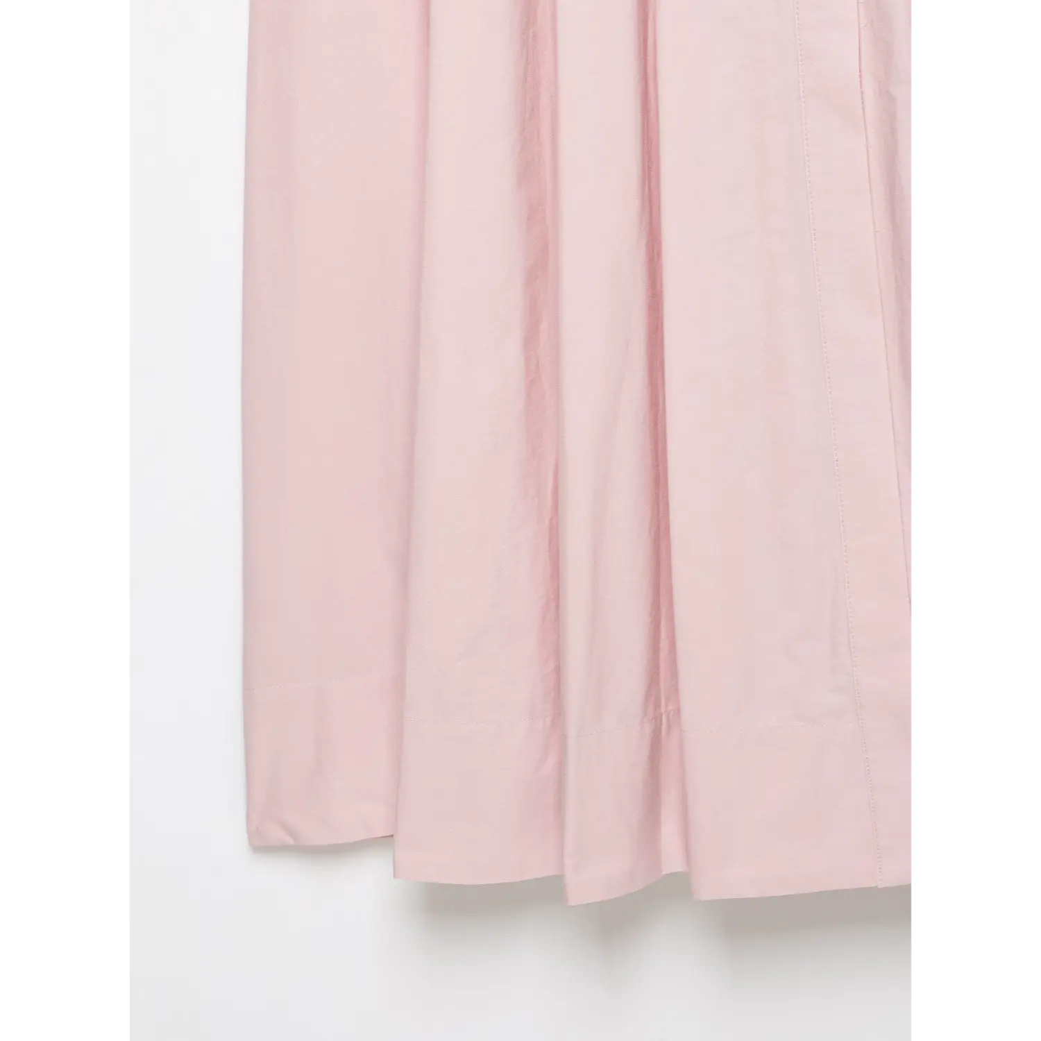 Close‑up of straight finished hem on pink maxi skirt