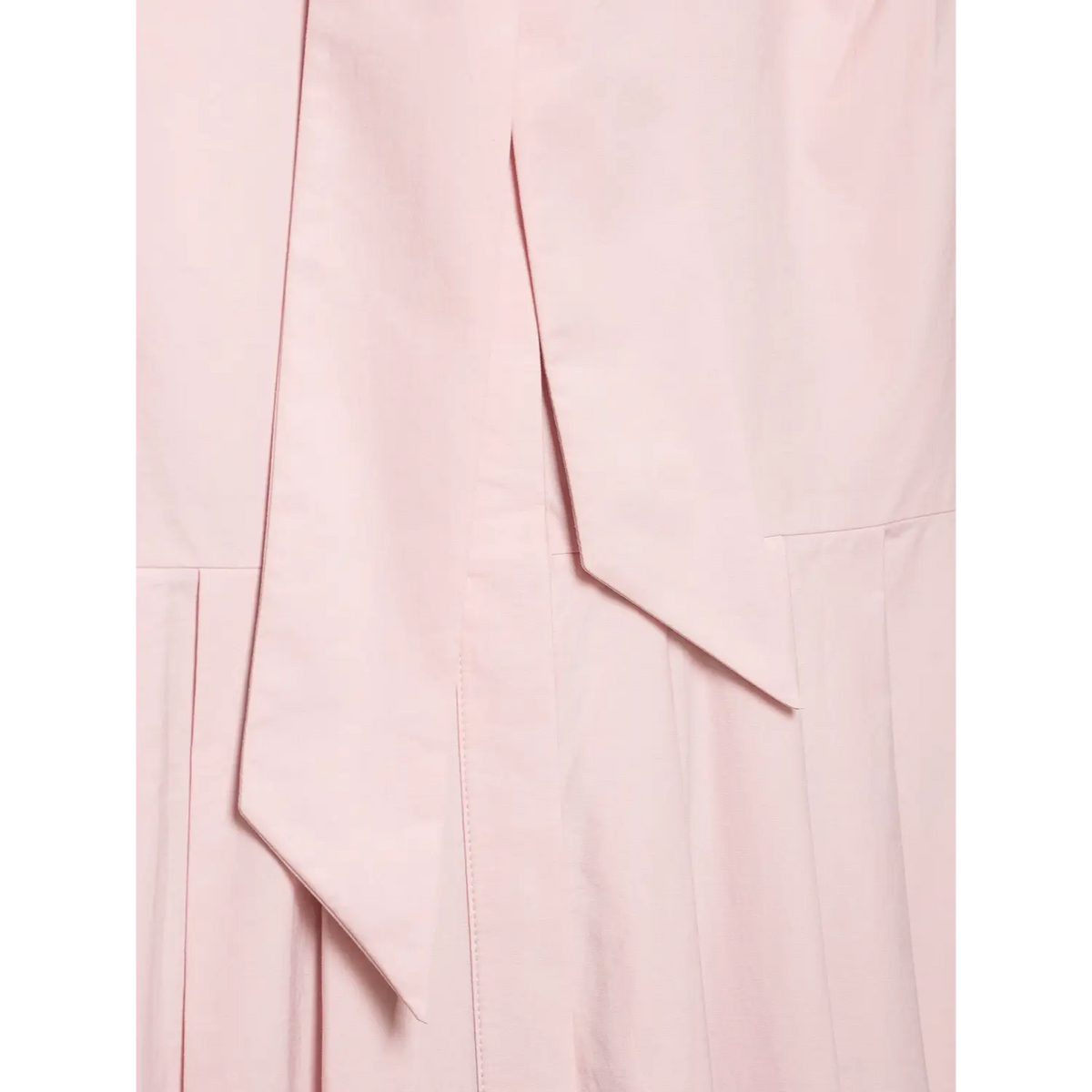 Close‑up of waist seam and hanging fabric sash detail