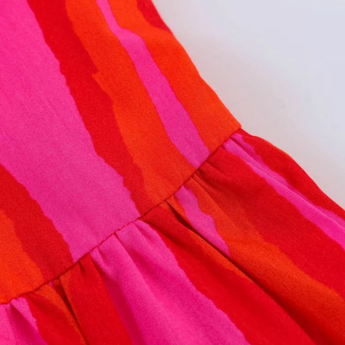 Close‑up of gathered waist and stripe fabric texture