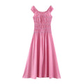 Flat lay front view of pink ruffle cap sleeve smocked tie‑front flowy maxi dress