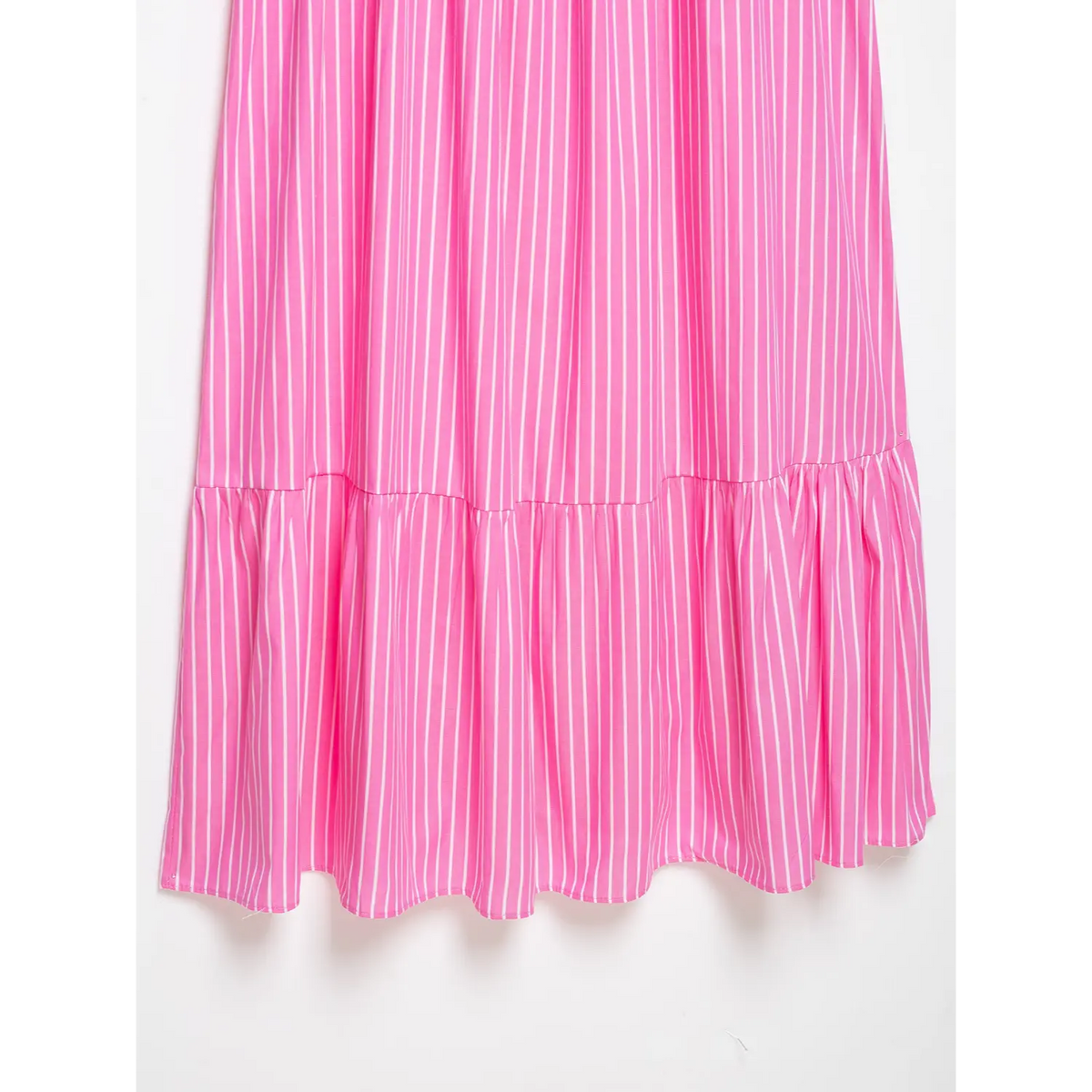 Partial shot of pink vertical stripe flowy skirt fabric