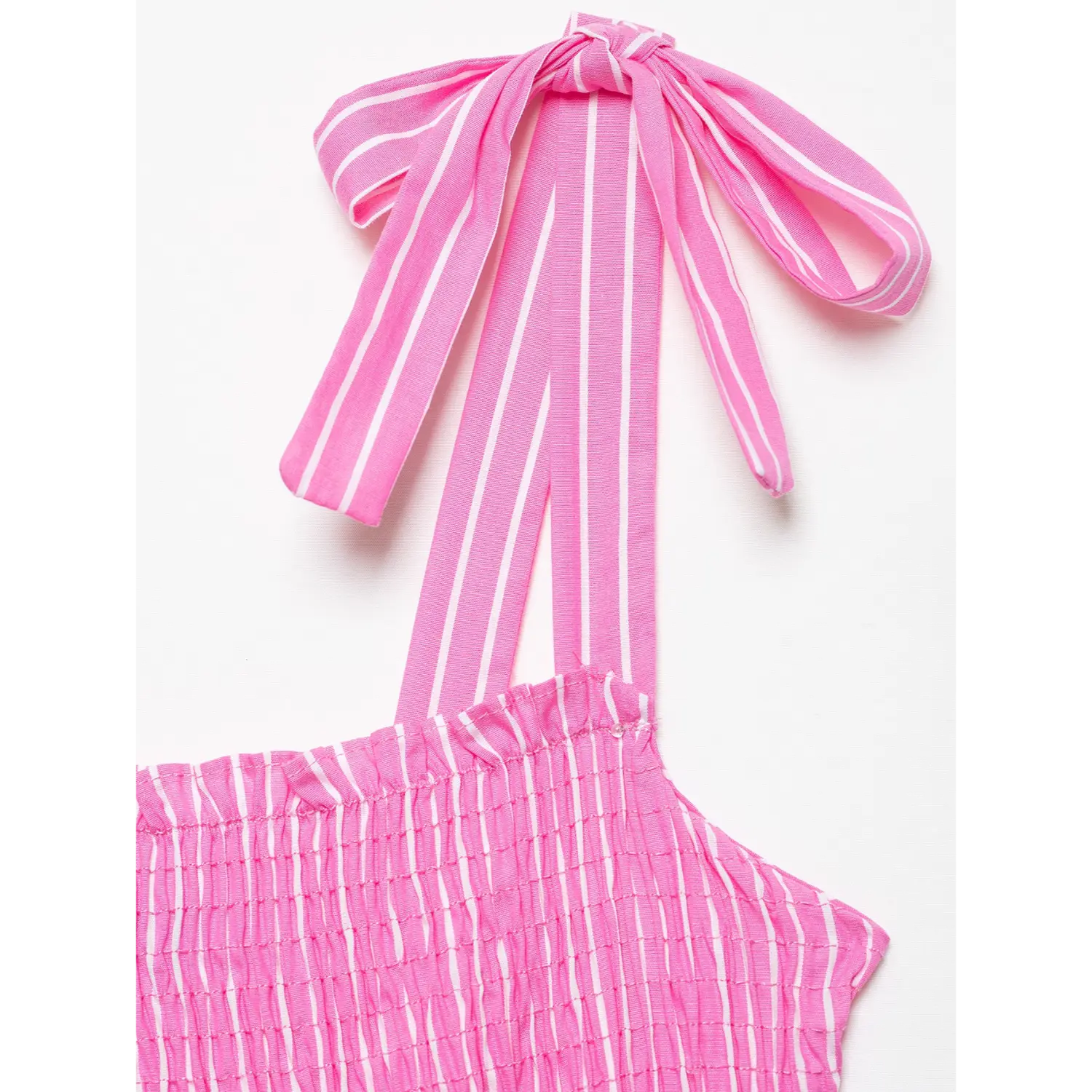 Macro close‑up of striped fabric tie bow on shoulder strap
