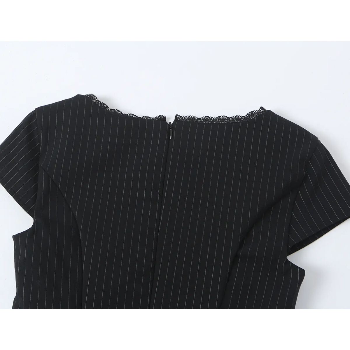 Close-up of back neckline, lace trim and center zipper