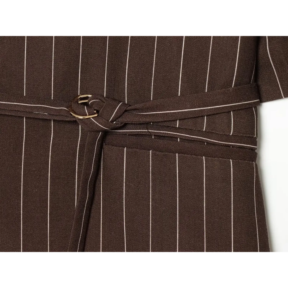 Close-up of self fabric belt and metal ring buckle