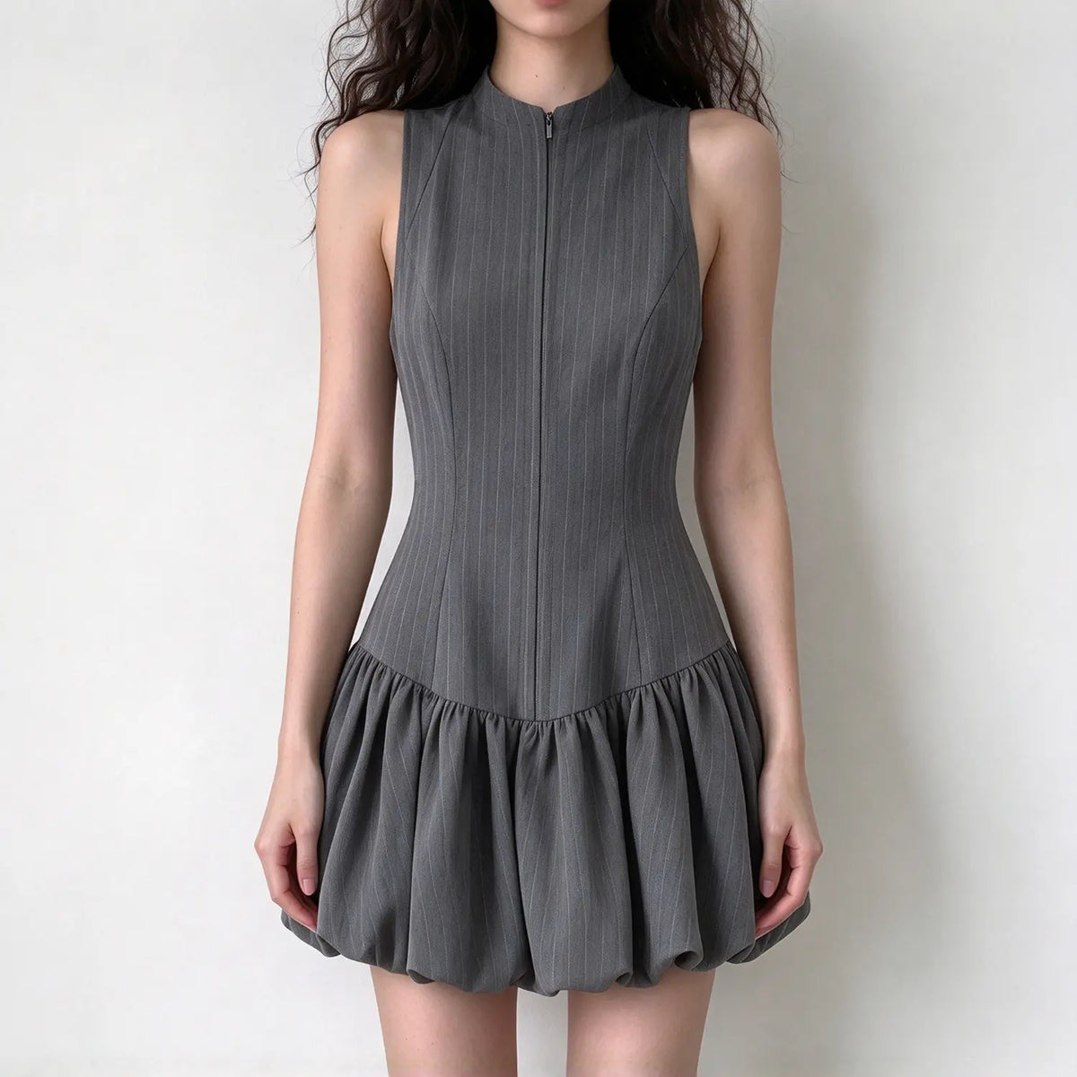 Model wearing dark gray pinstripe zip front stand collar bubble hem dress, front view