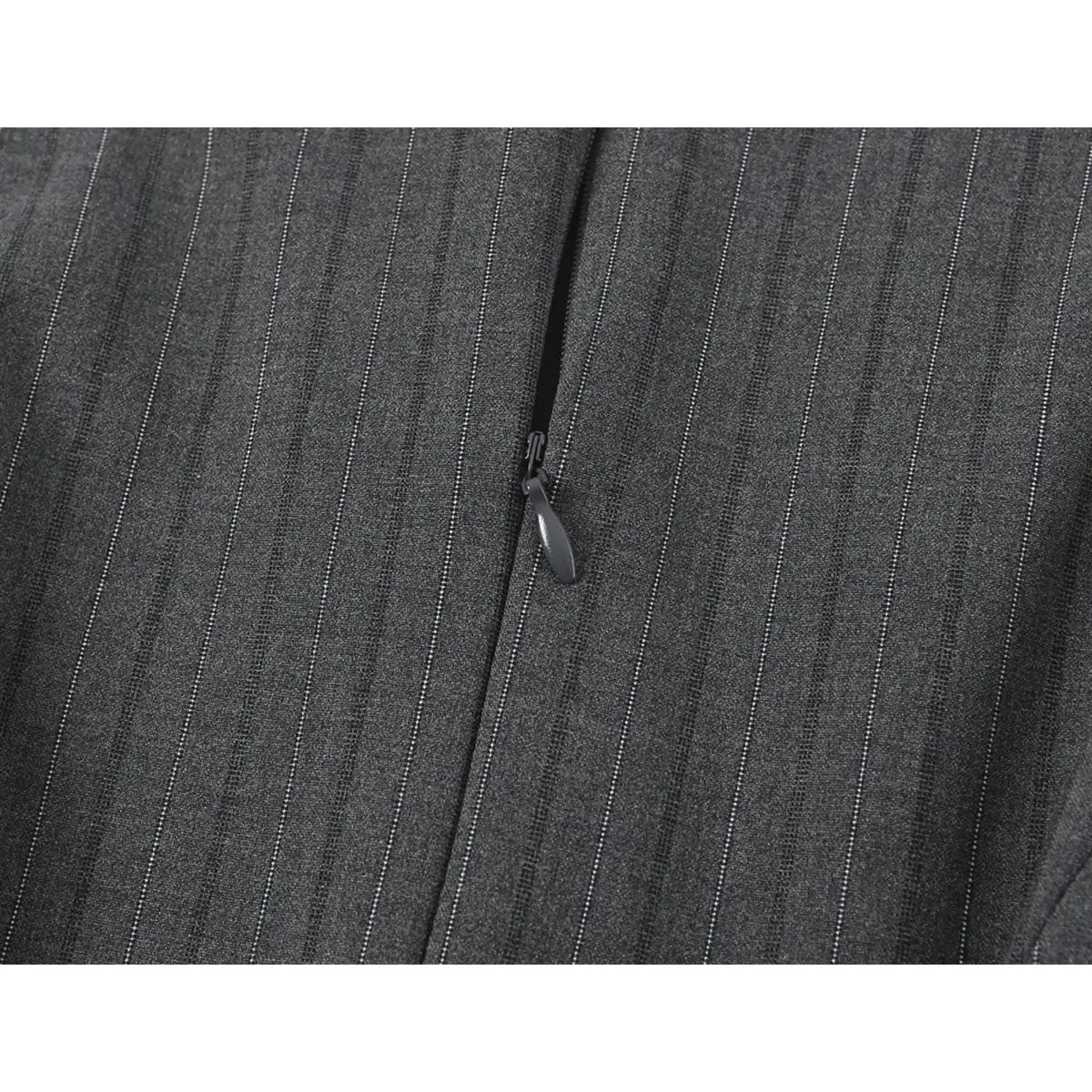 Close-up of front center zipper pull detail