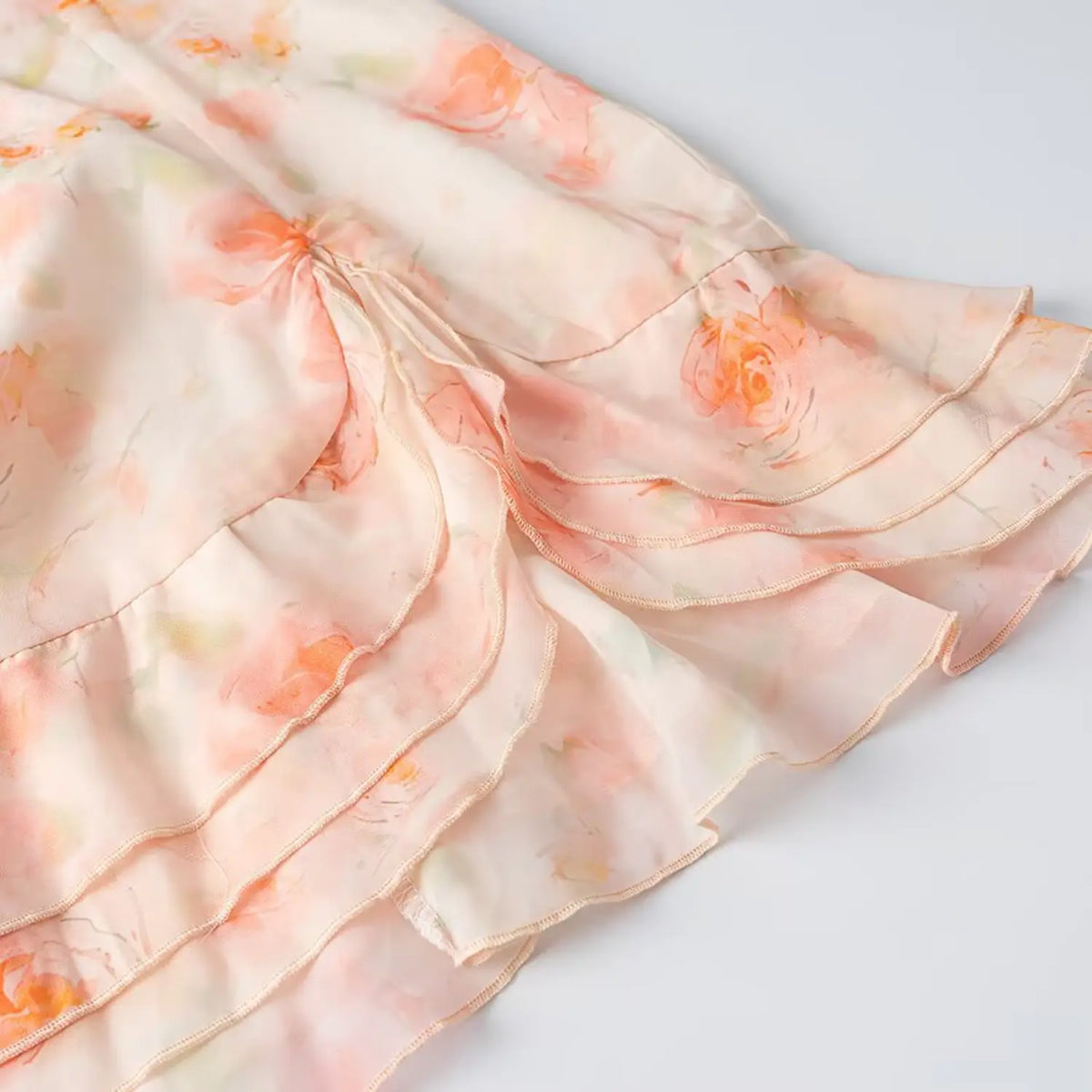 Close-up of layered ruffle wrap skirt hem