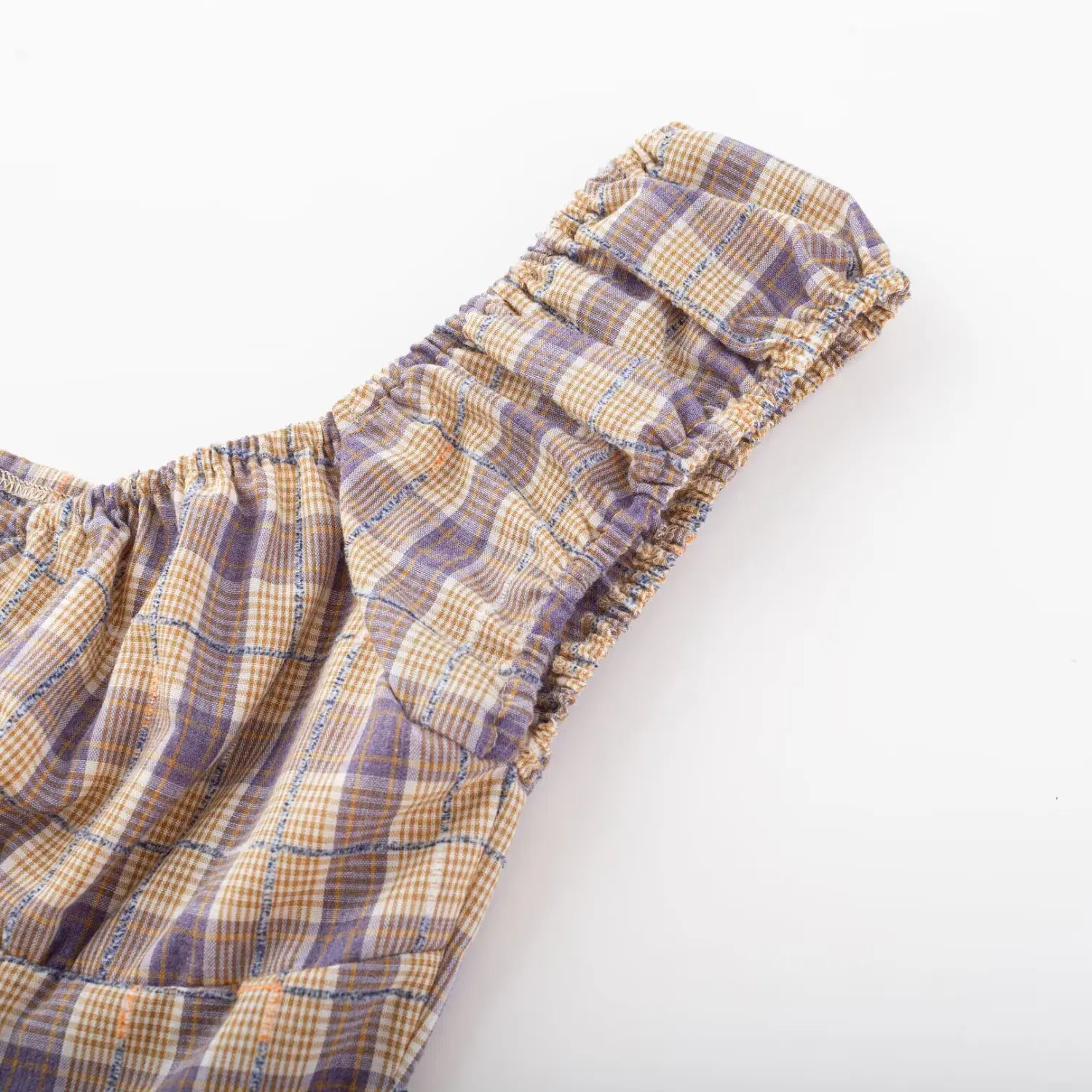 Purple yellow plaid crop top single strap close-up, full elastic ruched cap sleeve and stitched plaid fabric seam detail
