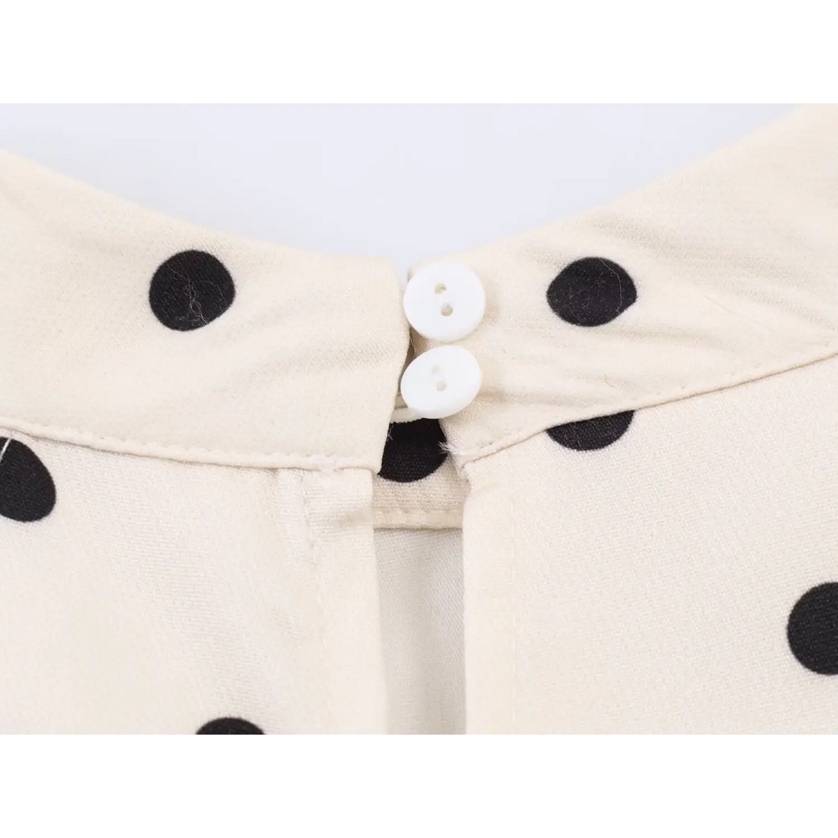 Close-up of back neck two button fastening
