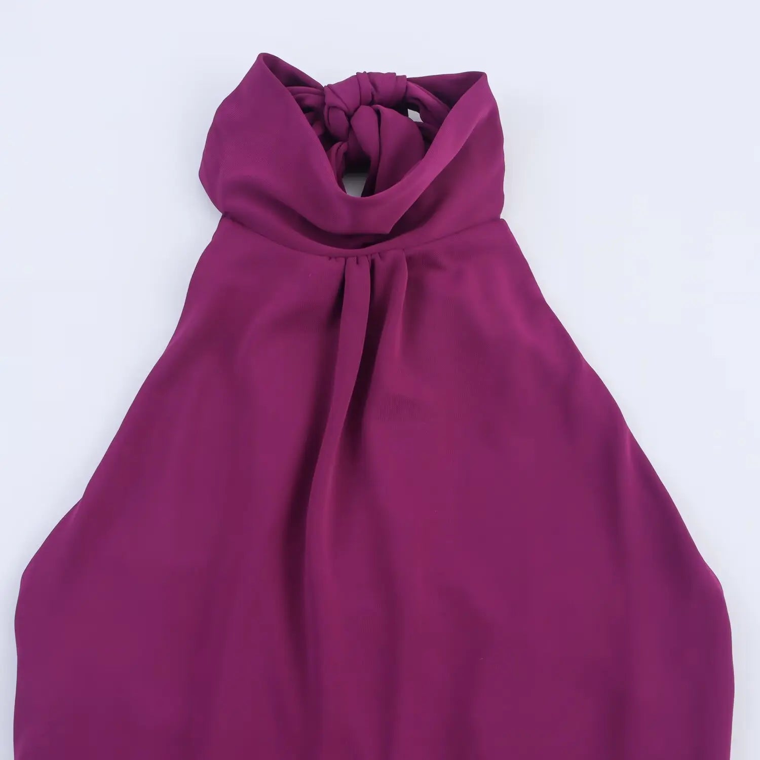 Close‑up of halter neck for plum cutout midi dress, show front pleated neckline