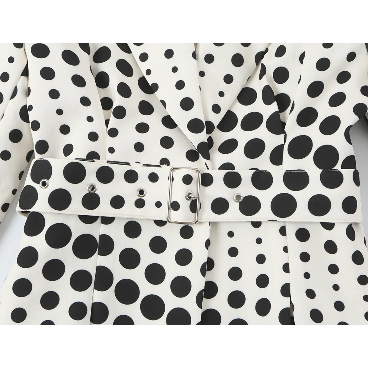 Close-up of self fabric belt and silver pin buckle
