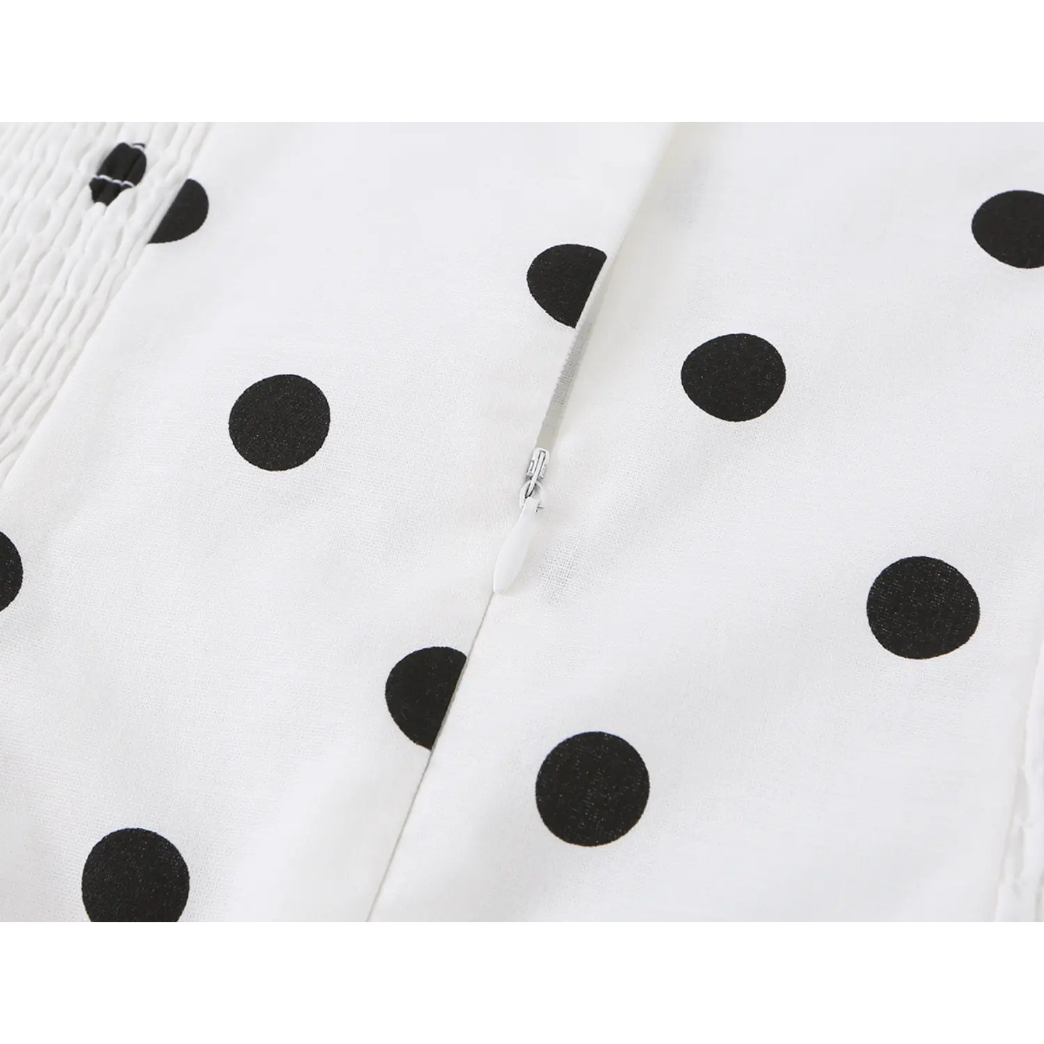 White black dot cami dress back invisible zipper flat close-up, smooth hidden zipper spliced smocked woven fabric white background shot