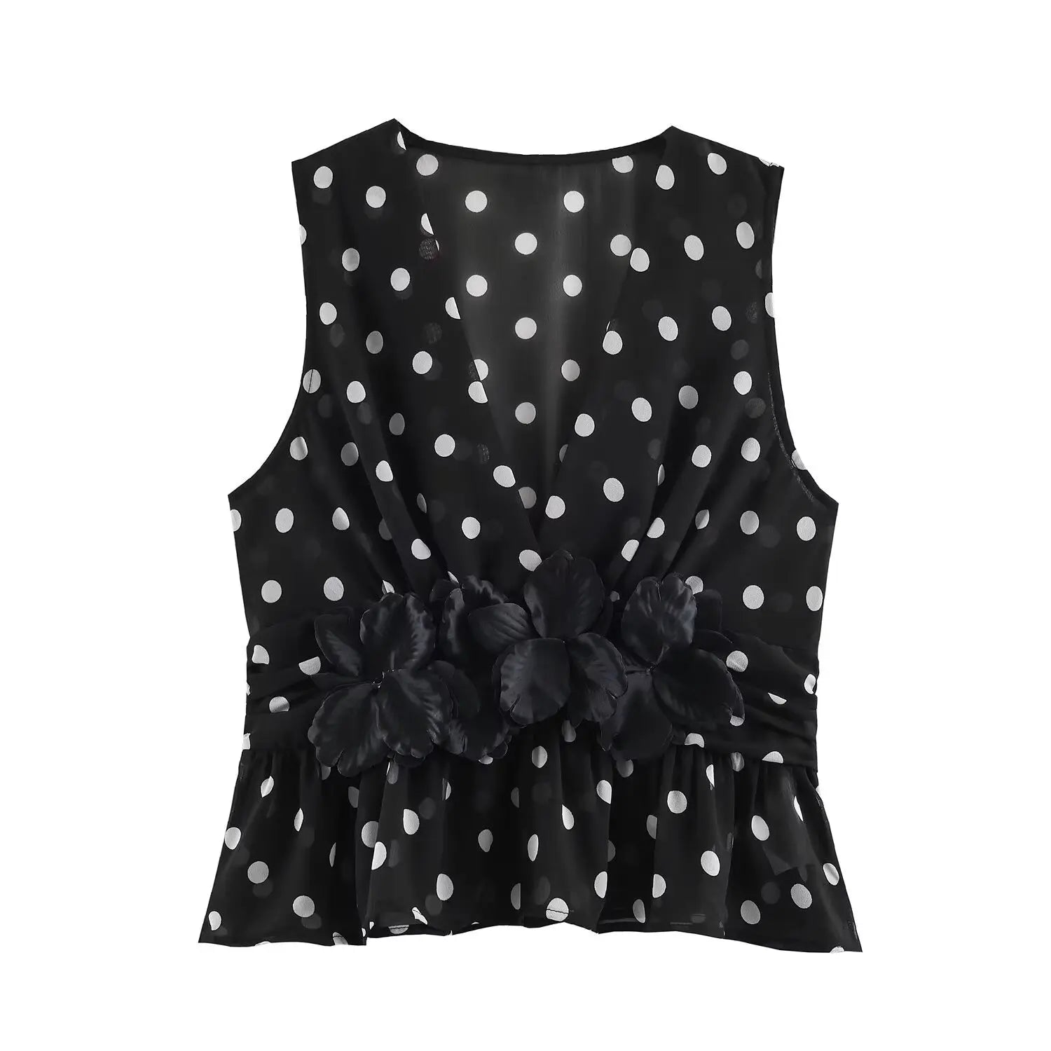 Garment front flat lay main view, black base white polka dot sheer chiffon, deep V neck, large 3D fabric floral applique at waist, peplum flared hem, sleeveless halter cut