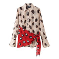 Beige watercolor dot print chiffon shirt front view with red polka dot wrap tie sash, long flared sleeve collared blouse