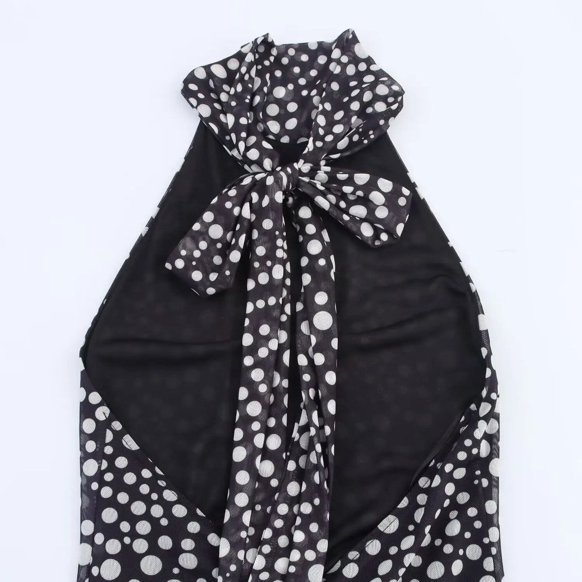 Detail of halter neck tie bow at open back with black inner lining