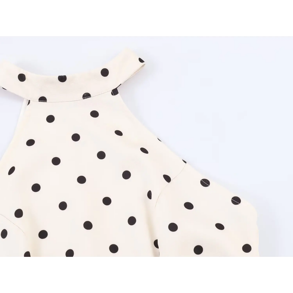 Close-up of halter neckline and shoulder cutout