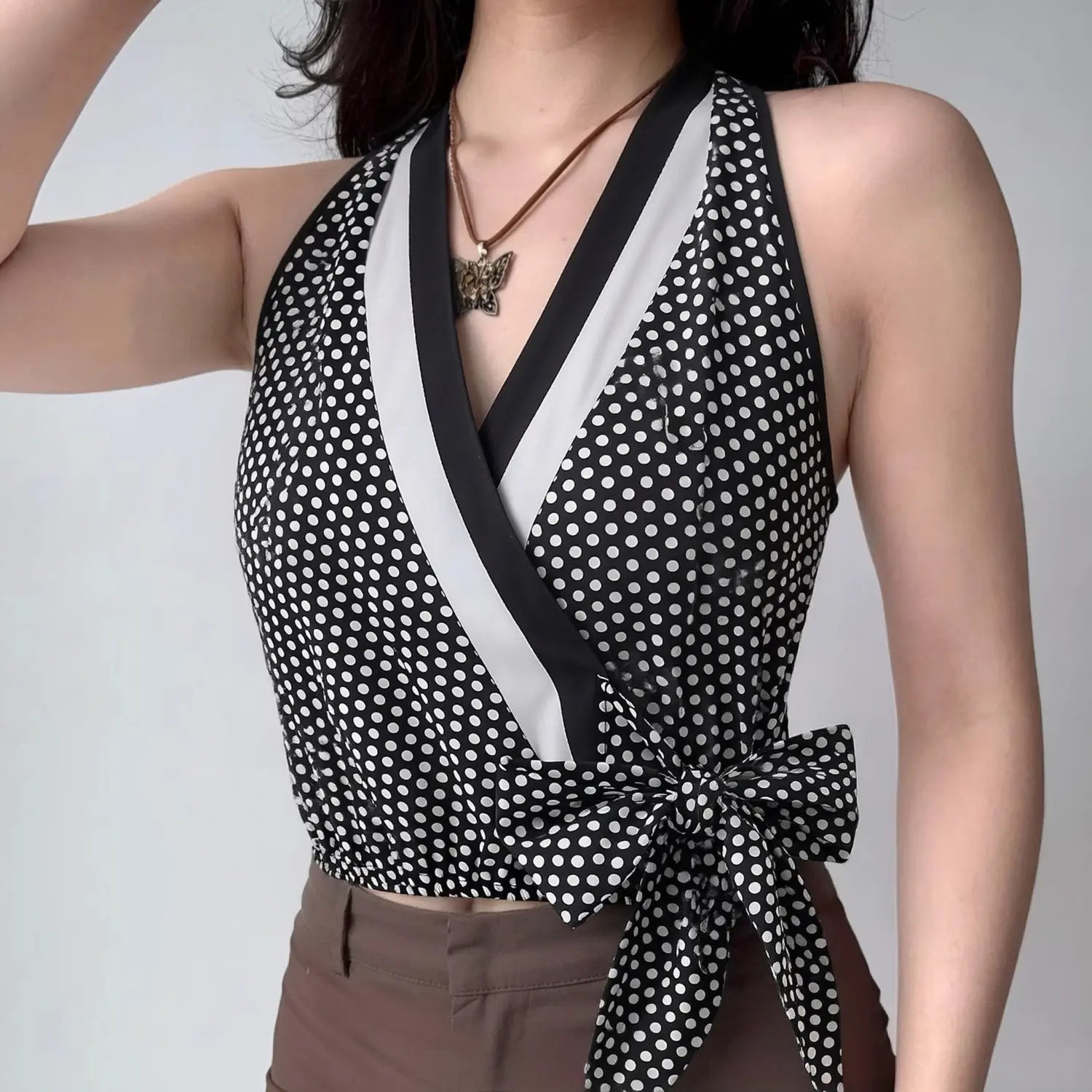 Model front lifestyle shot, halter wrap polka dot crop top, real daily wearing display