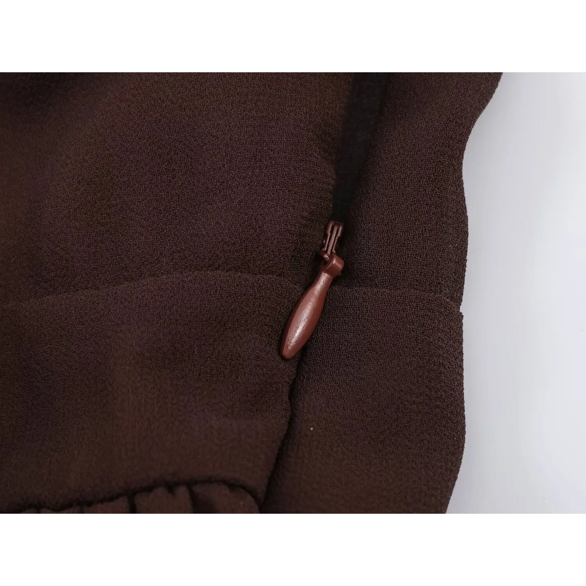Close-up of back waist zipper pull