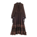 Front flat lay of dark brown polka dot ruffle trim tiered maxi dress