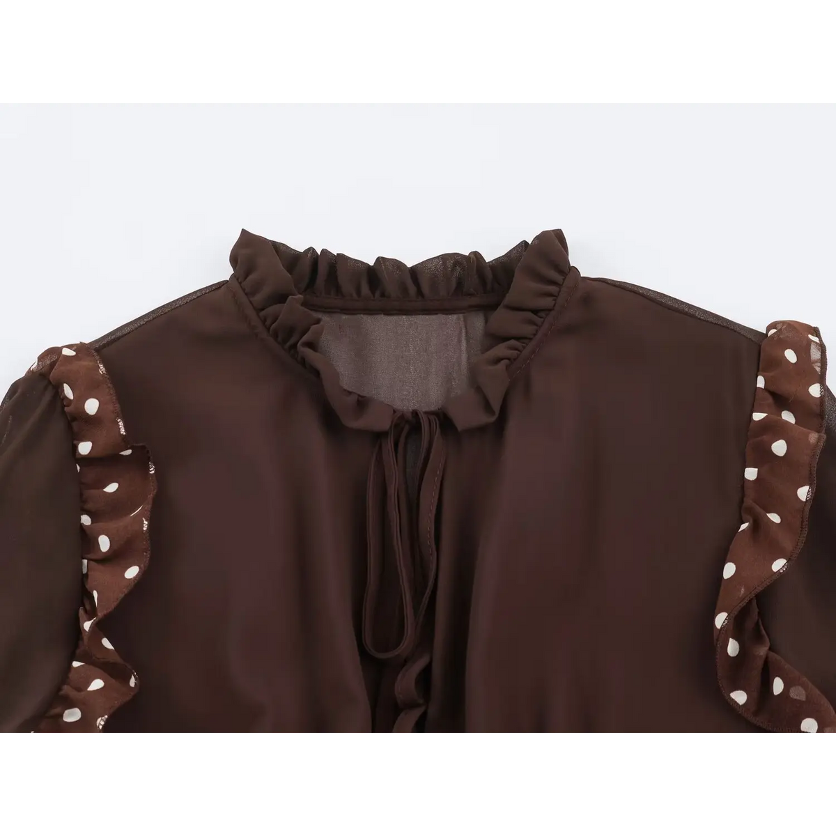 Close-up of ruffled high neck and tie fastening