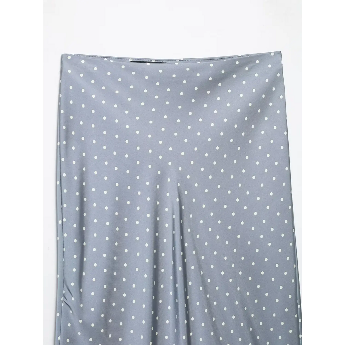 Close-up of straight waistband and dot pattern