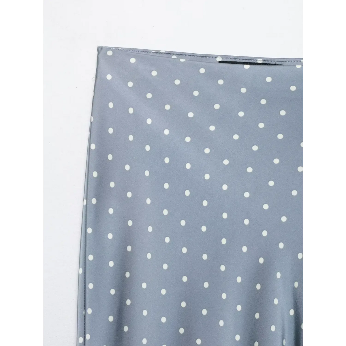 Close-up of waistband edge and dot print