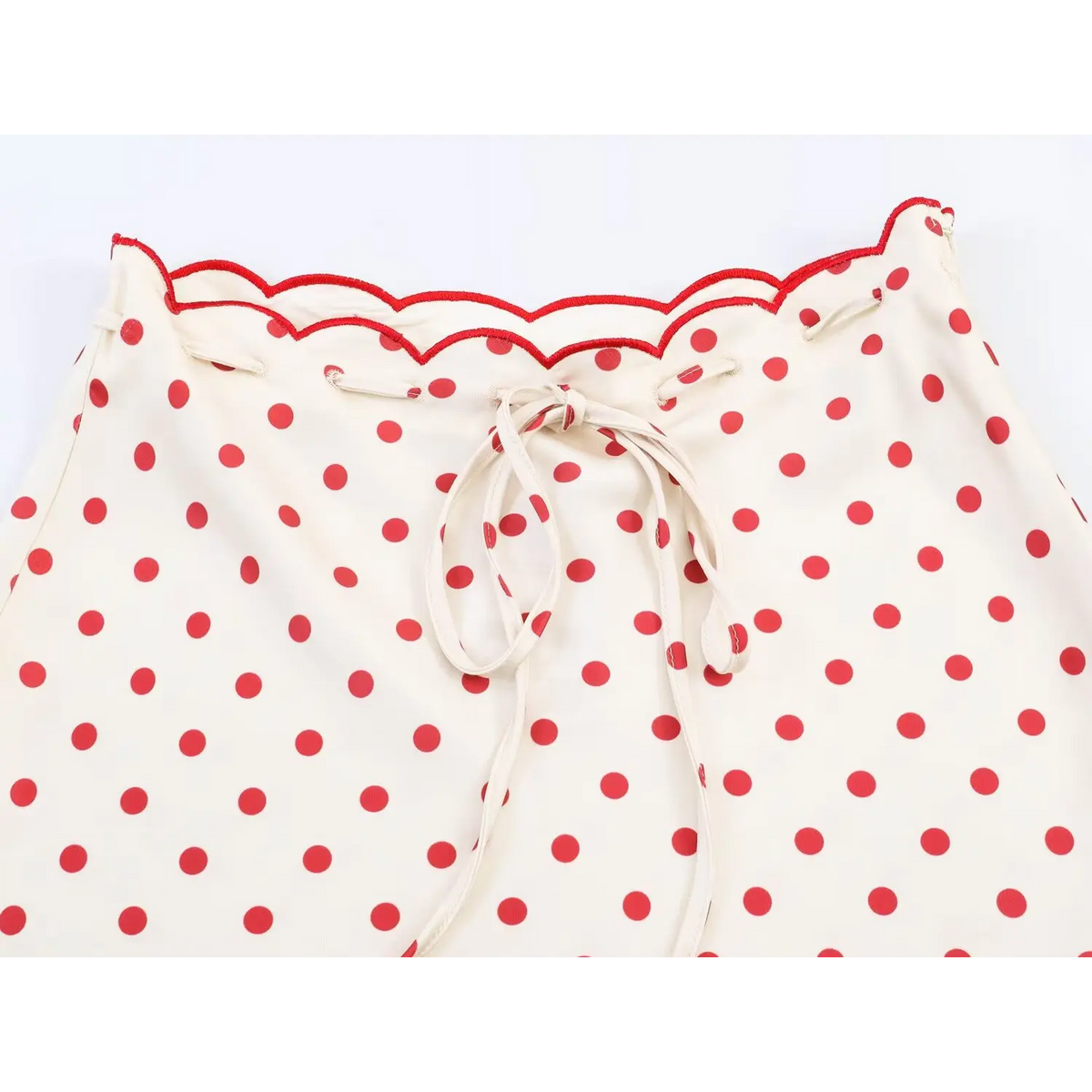 Close-up of scalloped waistband and self-tie drawstring