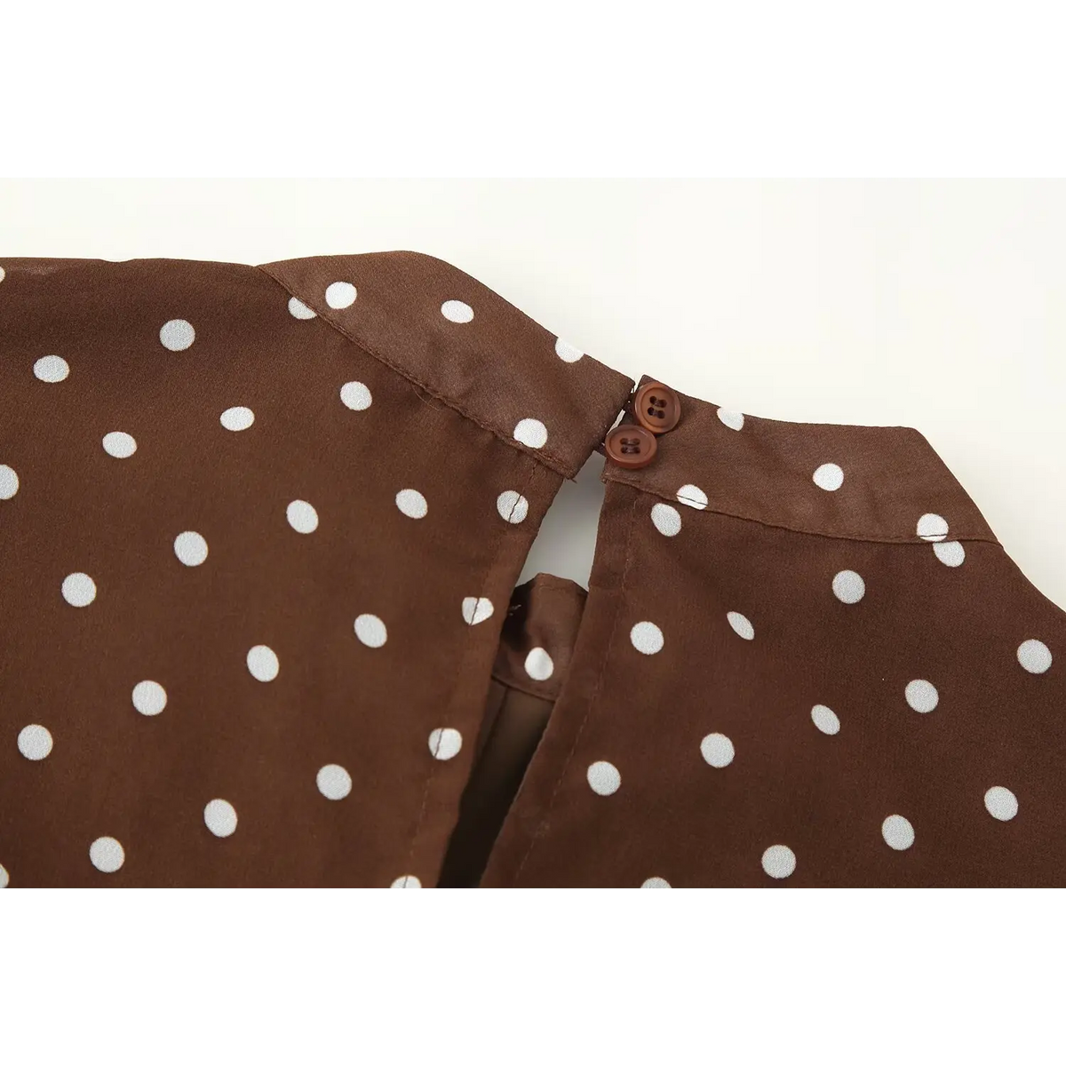 Close-up of back neck button