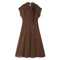 Front flat lay of polka dot tie neck cap sleeve fitted maxi dress