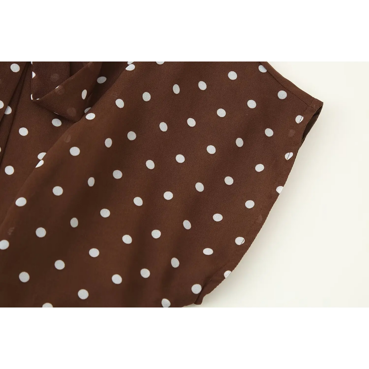 Close-up of cap sleeve and shoulder stitching