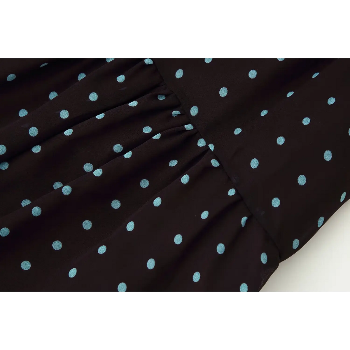 Close-up of tiered skirt seam