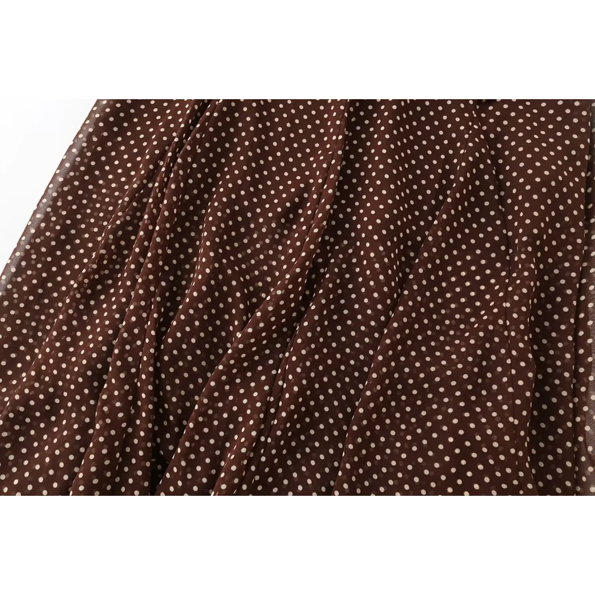 Close-up of chiffon polka dot fabric