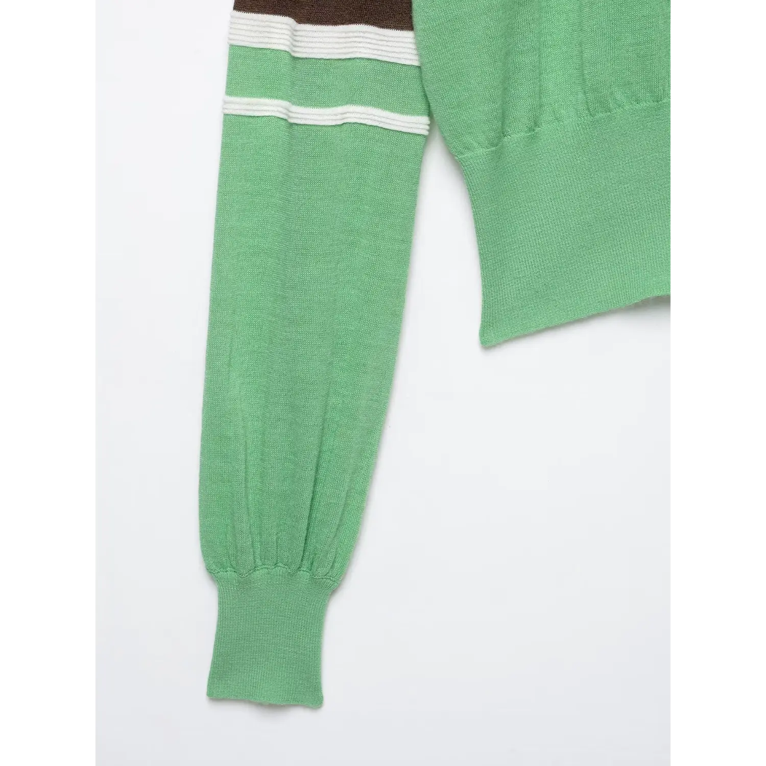 Side sleeve close‑up, bishop long sleeve with gathered ribbed cuff, green knit hem detail