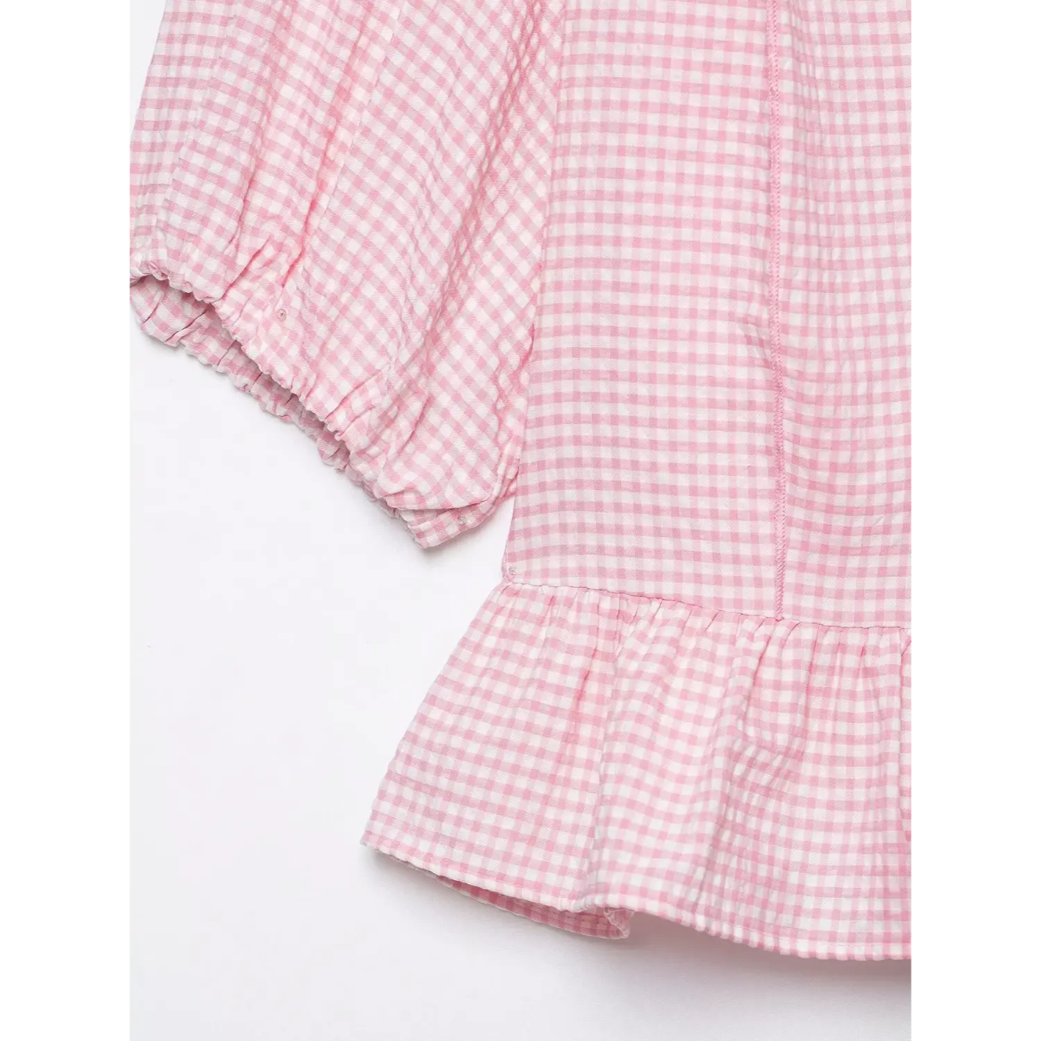 Short sleeve hem close-up, gathered elastic cuff, voluminous puff sleeve, pink gingham lightweight fabric