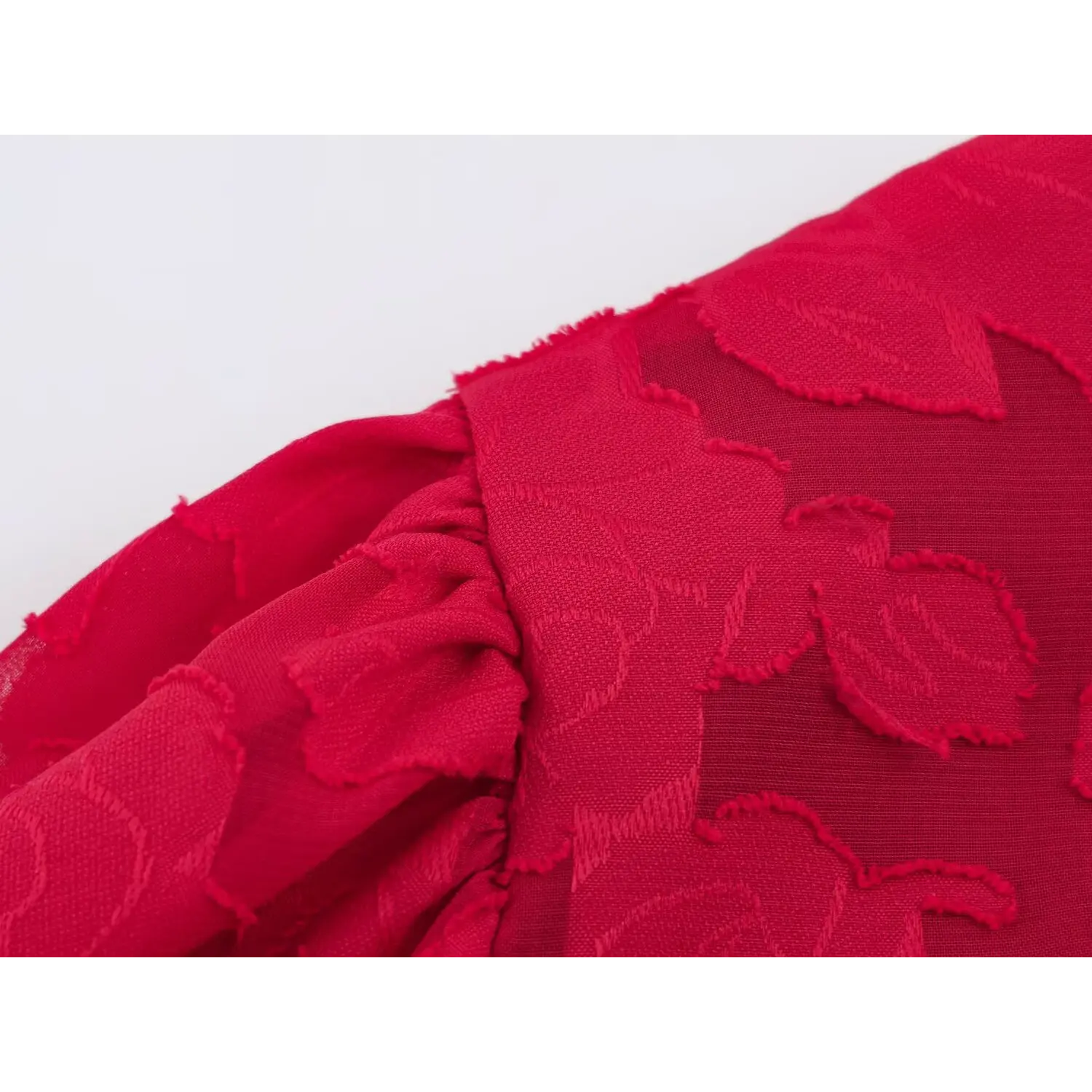 Cap puff sleeve hem seam detail, frayed floral jacquard fabric edge, gathered sleeve stitching