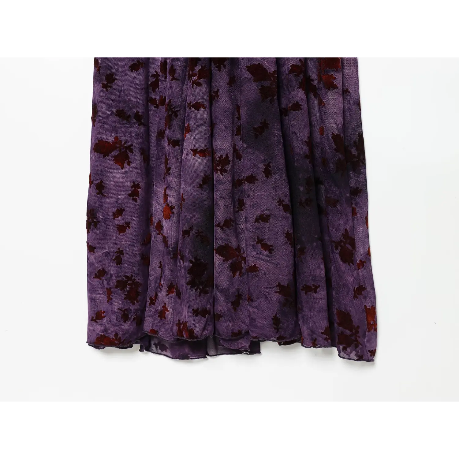 Close‑up of flowy long skirt, sheer mesh fabric with vintage burgundy floral print